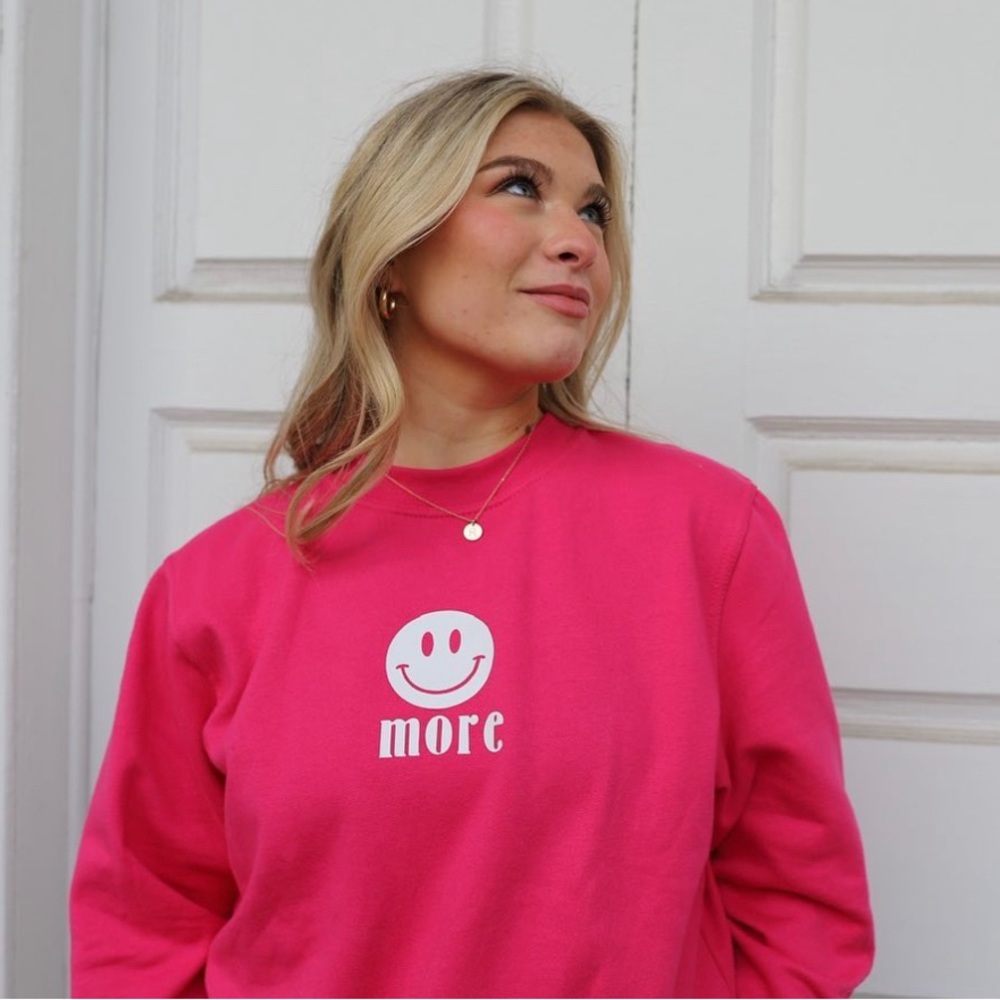 pink crewneck sweatshirt with the OG smile more logo!